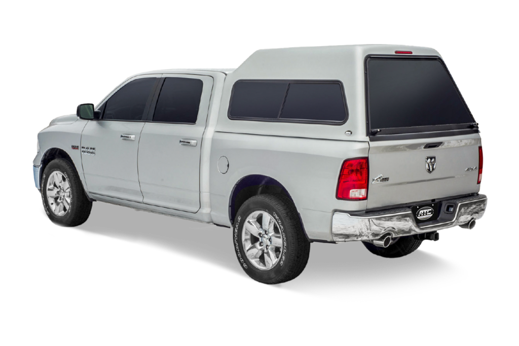 Silver dodge ram 1500 truck with ATC LHR XD cab-high truck cap